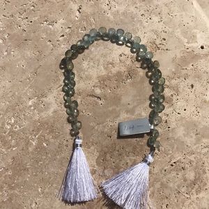 A strand of Moss Aquamarine